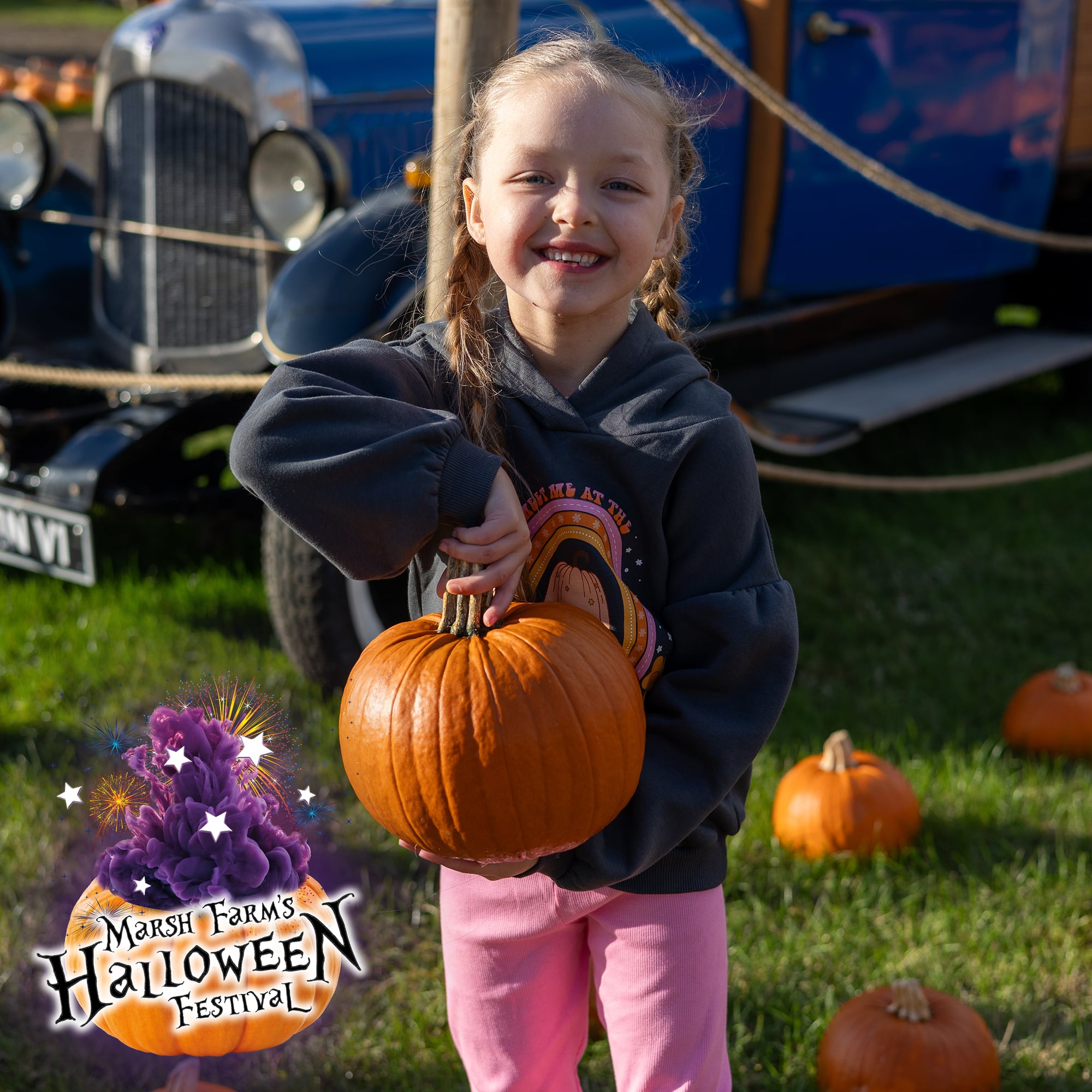 Little girl holding a pumpkin