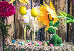 Green easter bunny with eggs on sticks