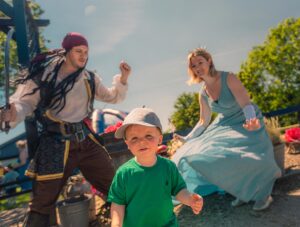 Toddler meeting the Fairy Godmother and a Pirate