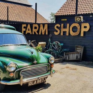 A wooden sign saying Farm Shop