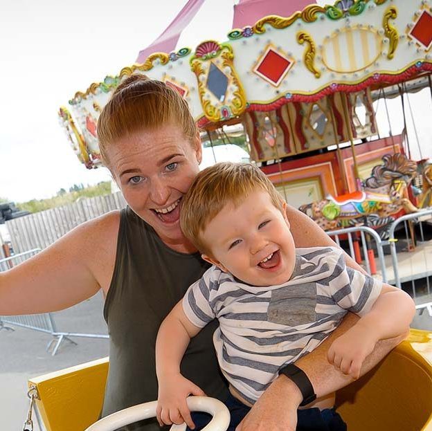 Mum and son enjoying the tea cups ride