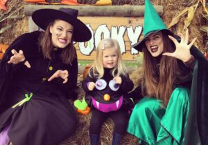 Two witches with a little girl