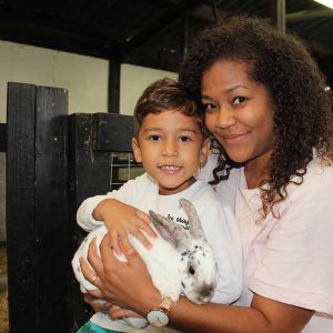 Mum and Son holding a Rabbit