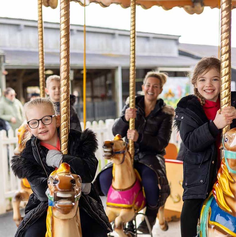 Children riding on a Carousel